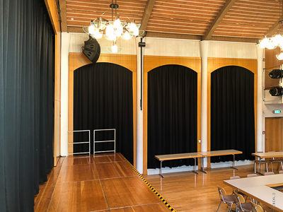 Main curtain, dim-out curtains and speaker covers for the Aschheim town hall